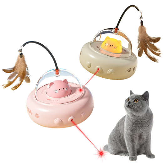 Cat toy with laser pointer and feather attachments next to a gray cat on a white background