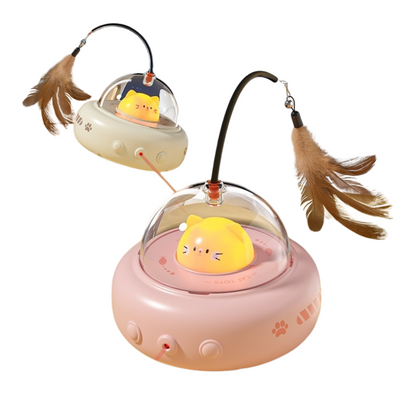 Pet toy with a yellow cat figure inside a transparent dome on a pink base, with feathers attached.
