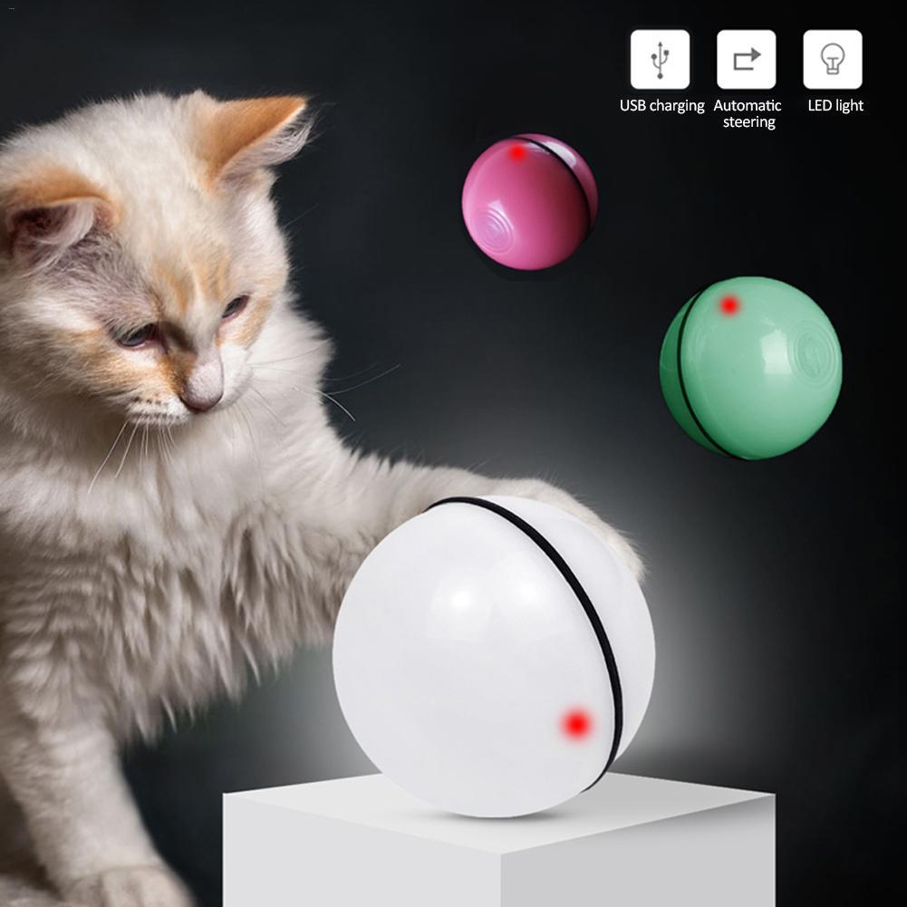 Cat playing with interactive LED rolling ball, showcasing all available color variants