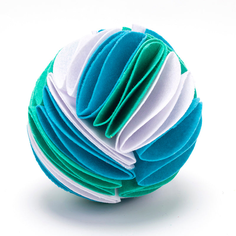 Dog playing with foldable snuffle ball IQ toy for slow feeding and mental stimulation blue variant